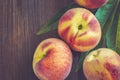 Peaches on dark wooden background