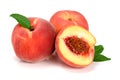 Peaches and half with green leaf isolated on white background Royalty Free Stock Photo
