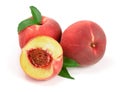 Peaches and half with green leaf isolated on white background Royalty Free Stock Photo