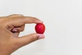 Peaches held in hand against white background red colour health benefits