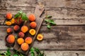Peaches with leaves on dark wooden board with peach in halves. Composition with ripe juicy peaches Harvest for food. Fresh organic Royalty Free Stock Photo