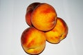 Peaches nectarines on a white background, macro Royalty Free Stock Photo