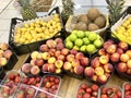 Peaches, strawberries, coconuts, apricots and limes for sale in the supermarket