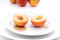 Peaches with syrup on white plate Royalty Free Stock Photo