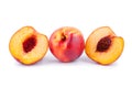 Peaches whole and cutted in halves on a white background isolated close up