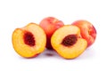 Peaches whole and cutted in halves on a white background isolated close up Royalty Free Stock Photo