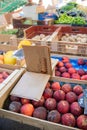 Peachs and vegetables on a market Royalty Free Stock Photo