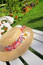 Peacuful summer garden with a hat Royalty Free Stock Photo