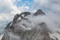 Peak of Altmann mountain in clouds, Alpstein, clouds, blue sky