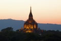 The peak of the ancient Buddhist temple of Gawdaw Palin at sunset. Bagan, Myanmar Royalty Free Stock Photo