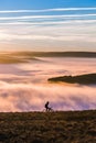 Peak District biker over the clouds