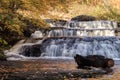 Peak fall foliage surrounds beautiful cascading middle Shohola Falls