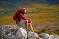 The peak has its perks. a young man enjoying a hike through the mountains. Royalty Free Stock Photo