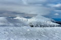 Peak of the Mountain. Beautiful landscape on the cold winter day. View of high mountains with snow white peaks. Royalty Free Stock Photo