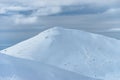 Peak of the Mountain. Beautiful landscape on the cold winter day. View of high mountains with snow white peaks. Royalty Free Stock Photo