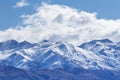 Peak of mountain snow with white cloud and blue sky Royalty Free Stock Photo