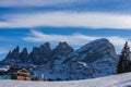 The peak of the mountains of the dolomites during sunset. High mountain landscape of the Dolomites in winter. Fantastic orange