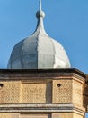 Peak on the roof of the building against the blue sky Royalty Free Stock Photo