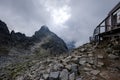 peak of Rysy mountain covered in mist. autumn ascent on hiking t