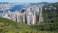 Peak view from the green suburb peak to the crowded city urban in hong kong with part of view of victoria harbour Royalty Free Stock Photo