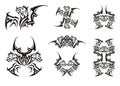 Peaked winged dragon symbols in tribal style Royalty Free Stock Photo