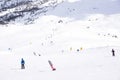 The peaks of the Alps mountains covered with snow. the ski slopes crowded with skiers on a sunny winter day Royalty Free Stock Photo