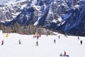 The peaks of the Alps mountains covered with snow. the ski slopes crowded with skiers on a sunny winter day Royalty Free Stock Photo