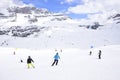 Ski slope with skiers in the Alps Royalty Free Stock Photo