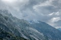 Peaks getting hidden by the clouds in the Alps Royalty Free Stock Photo