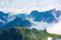 Peaks of mountain ridge above the clouds Royalty Free Stock Photo