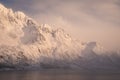 Peaks of norway in lofoten islands. near to svolvaer town. ambient light after heavy snow in the fjord. soft light and very calm a Royalty Free Stock Photo