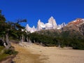 The peaks surrounding Mount Fitz Roy etched against a clear blue sky