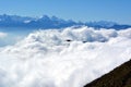 Peaks towering above the clouds Royalty Free Stock Photo