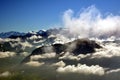 Peaks towering above the clouds Royalty Free Stock Photo