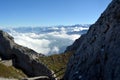 Peaks towering above the clouds Royalty Free Stock Photo