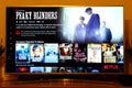 Peaky Blinders - Netflix television screen with popular series choice. Movies Royalty Free Stock Photo