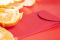 Peal Mandarin oranges and Chinese New Year red packet. Chinese New Year celebration concept Royalty Free Stock Photo