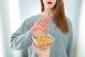 Peanut allergy concept - food intolerance. Young girl refuses to eat peanuts