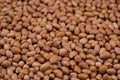 Peanut background, lots of raw peeled brown peanuts close-up. Royalty Free Stock Photo