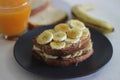 Peanut butter banana honey toast sandwich served with Orange juice, an easy breakfast idea Royalty Free Stock Photo