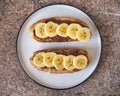 Peanut butter and banana sandwiches, healthy snack on a round plate Royalty Free Stock Photo