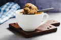 Peanut Butter and Chocolate Chips Mug Cake, Homemade Cake Cooked in the Microwave Royalty Free Stock Photo