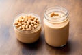 Peanut butter in a glass jar with peanuts on a wooden background. healthy food concept. Generative AI Royalty Free Stock Photo