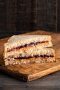 Peanut Butter and Grape Jelly Sandwich on a Wooden Cutting Board Royalty Free Stock Photo
