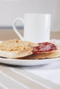 Peanut butter and jam on slices of bread with cup of coffee Royalty Free Stock Photo