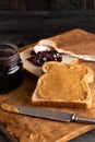 Peanut Butter and Jelly Sandwich on a Wooden Kitchen Counter Royalty Free Stock Photo