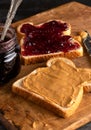 Peanut Butter and Jelly Sandwich on a Wooden Kitchen Counter Royalty Free Stock Photo