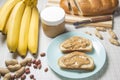 Peanut butter, loaf, banana . Breakfast with peanut butter. Healthy snack - vegetarian bread loaf with peanut butter and