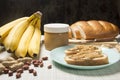 Peanut butter, loaf, banana . Breakfast with peanut butter. Healthy snack - vegetarian bread loaf with peanut butter and