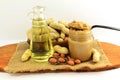 Peanut butter and peanuts whole and peeled with peanut oil Royalty Free Stock Photo
